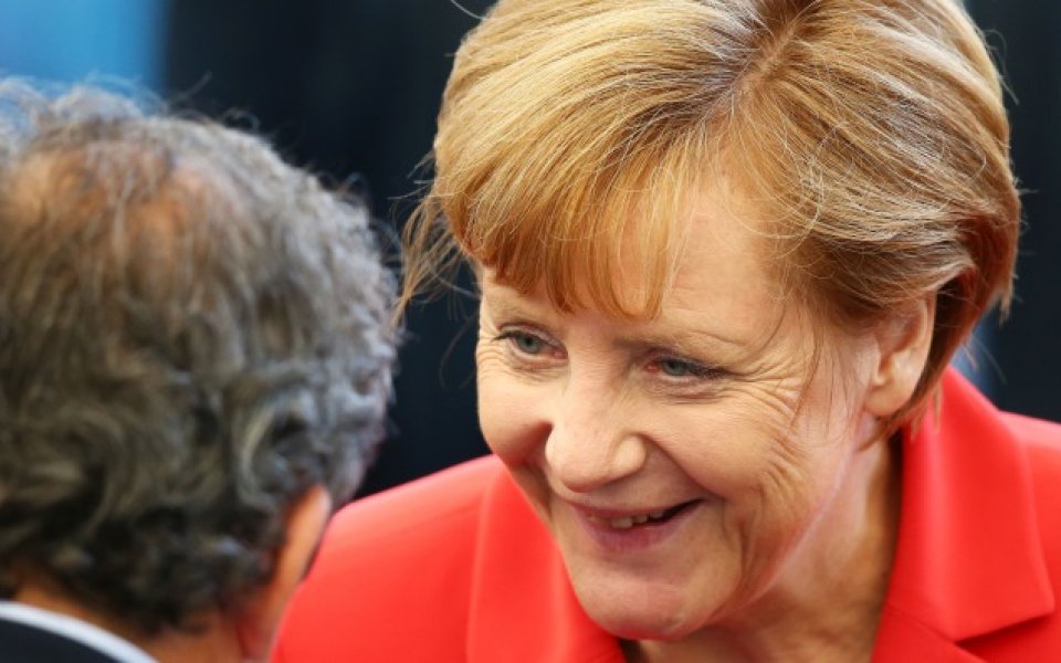 Ангела Меркел купонясва с националите в съблекалнята
