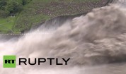 Taiwan: Flood waters jet out of Shihmen Dam after deluge of Dujuan Typhoon