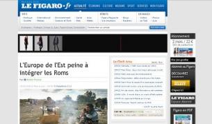 Статията е илюстрирана със снимка на семейство, което живее в бидонвил край Лион